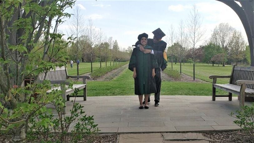 Rinki Goswami graduated from the Wright State University Boonshoft School of Medicine on Saturday. Goswami’s family watched the virtual graduation ceremony together as her father ceremoniously “hooded” her at Cox Arboretum MetroPark. CONTRIBUTED.