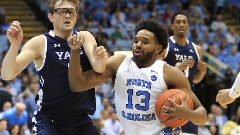 Yale's Eric Monroe, left,  tries to stop North Carolina's Jeremiah Francis at Dean Smith Center on December 30, 2019 in Chapel Hill, North Carolina. (Photo by Streeter Lecka/Getty Images)