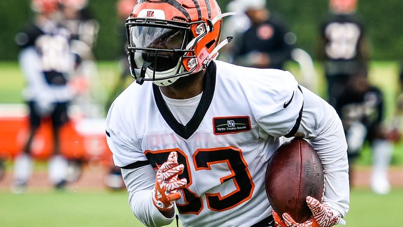 Bengals’ running back Tra Carson carries the ball during organized team activities Tuesday, May 22 at the practice facility near Paul Brown Stadium in Cincinnati. NICK GRAHAM/STAFF