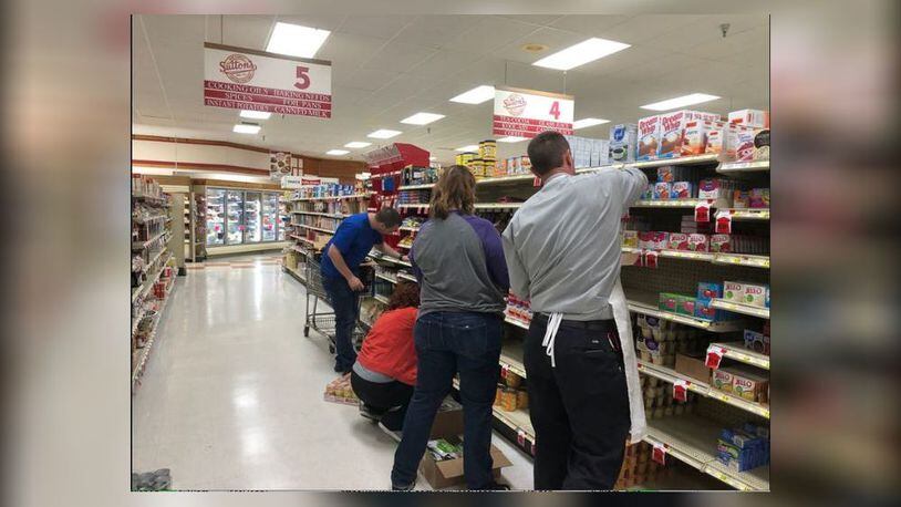 On a Saturday in November 2019,  Arcanum residents took to stocking shelves at Sutton's Foods  to help out local grocery store./Contributed