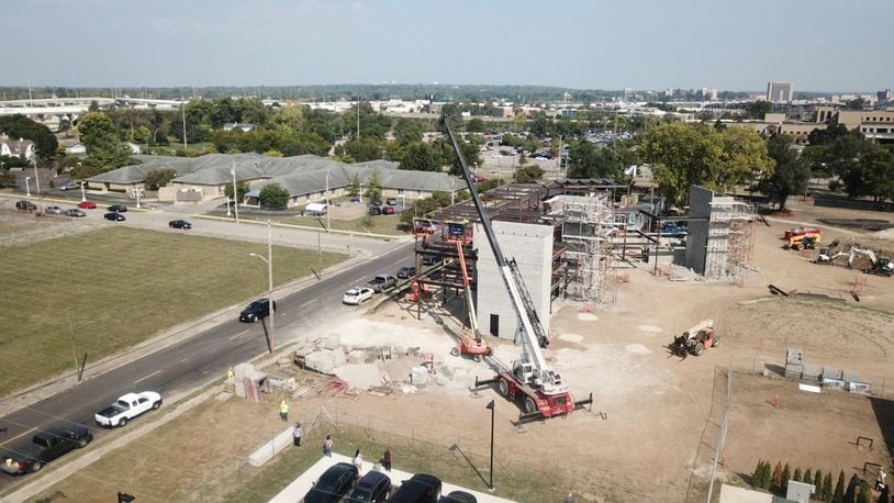 The final beam was placed Friday for the sober living apartments that are part of the OneFifteen campus in Dayton. STAFF
