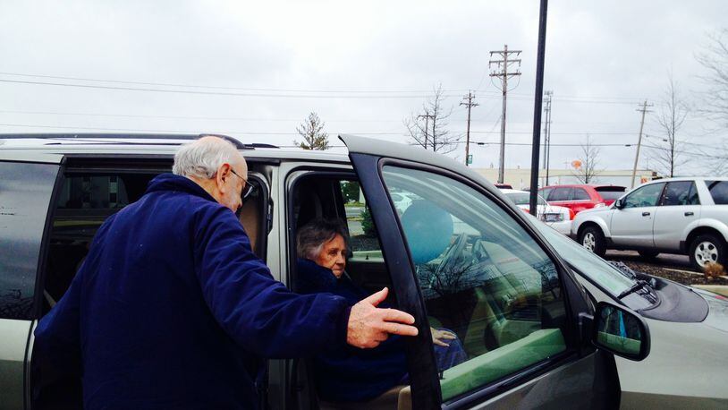 Gene Hendel, a volunteer driver for the West Chester Twp. senior transportation program helps 82-year-old Rita Penny into the van at the Senior Activity Center.