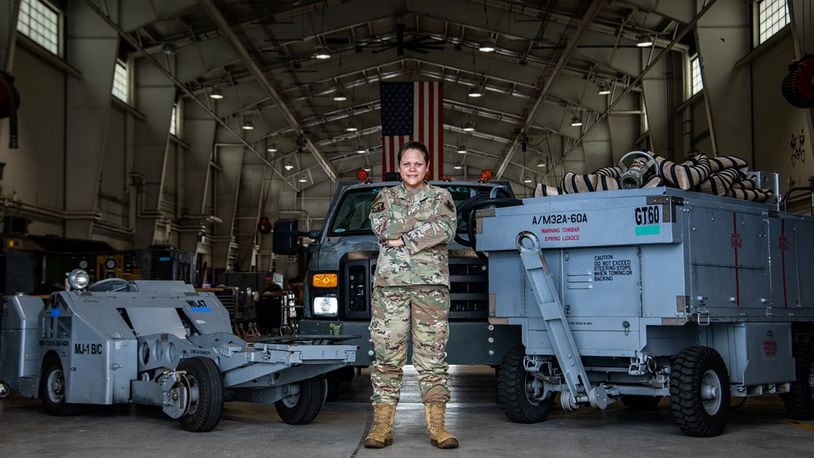 Tech. Sgt. Natalia Wood, 20th Equipment Maintenance Squadron aerospace ground equipment maintenance Airman, poses in her workplace while showcasing the 20th Fighter Wing assets she maintains at Shaw Air Force Base, S.C., Aug. 25. In her role on the women’s initiative team, she helped champion the effort to ensure practical lactation spaces and breastmilk storage for women in the Department of the Air Force. U.S. Air Force photo/Staff Sgt. Sean Sweeney