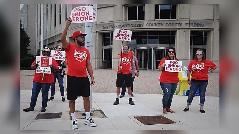 Members of the Professionals Guild of Ohio, the union that represents Montgomery County Children Services workers, protested Friday, Sept. 6, 2019, outside the Dayton and Montgomery County courts building.