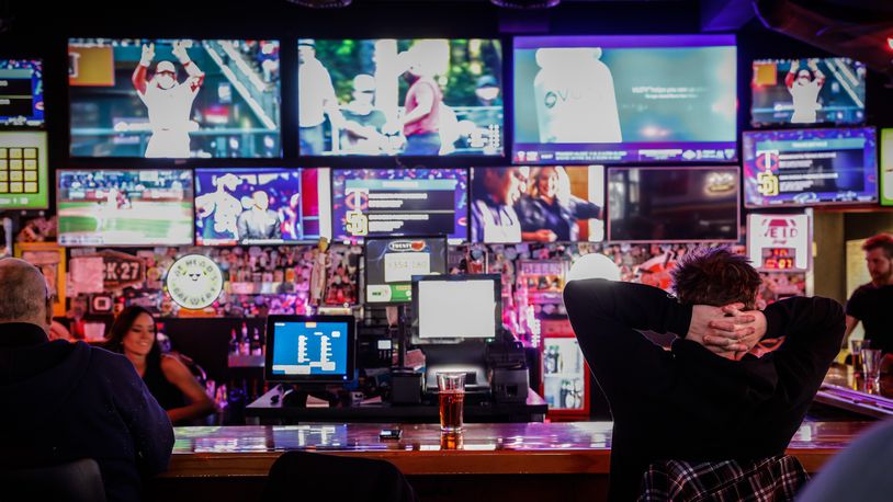 Baseball was on the televisions at Fricker's on Springboro Pike near the Dayton Mall on Thursday evening April 7, 2022. Nearly 50 local establishments have been pre-approved to apply to have a sports betting kiosk in 2023. JIM NOELKER/STAFF