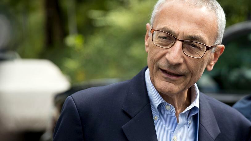Hillary Clinton campaign chairman John Podesta speaks to members of the media outside Clinton’s home in Washington. The WikiLeaks organization on Oct. 7, posted what it said were thousands of emails from Podesta, including some with excerpts from speeches she gave to Wall Street executives and others — speeches she has declined to release despite demands from Trump. (AP Photo/Andrew Harnik)