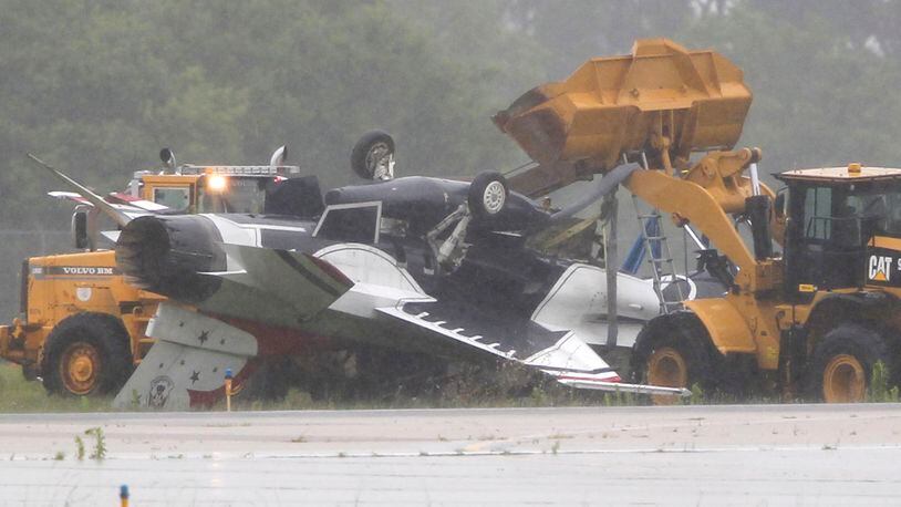 A Thunderbird jet flipped over after taxiing at Dayton International Airport on Friday, June 23, 2017. TY GREENLEES / STAFF