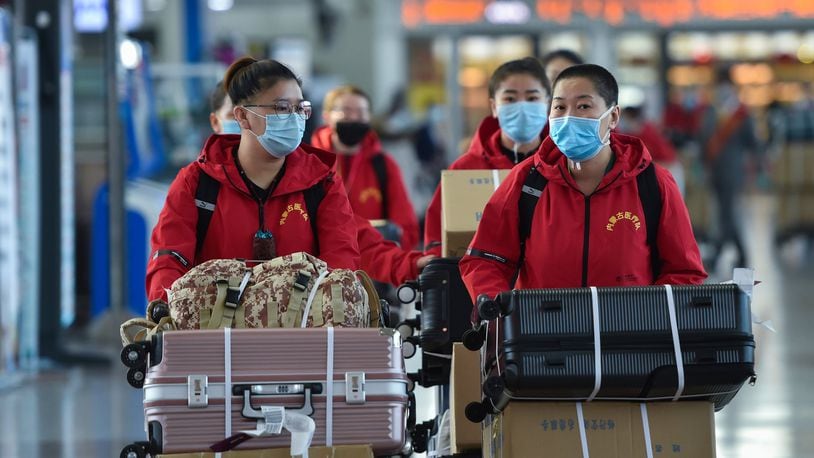 Medical team members prepare to check in at Hohhot Baita International Airport before leaving for Hubei Province in Hohhot, capital of north China’s Inner Mongolia Autonomous Region, on Tuesday, Feb. 18, 2020. The seventh batch of medical workers from Inner Mongolia Autonomous Region to Hubei Province departed Tuesday to help the novel coronavirus control efforts there. (Liu Lei/Xinhua/Zuma Press/TNS)