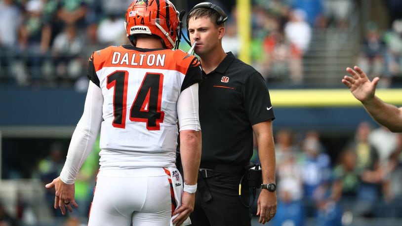 SEATTLE, WASHINGTON - SEPTEMBER 08: Andy Dalton #14 and head coach Zac Taylor of the Cincinnati Bengals have a conversation in the fourth quarter during their game against the Seattle Seahawks at CenturyLink Field on September 08, 2019 in Seattle, Washington. (Photo by Abbie Parr/Getty Images)