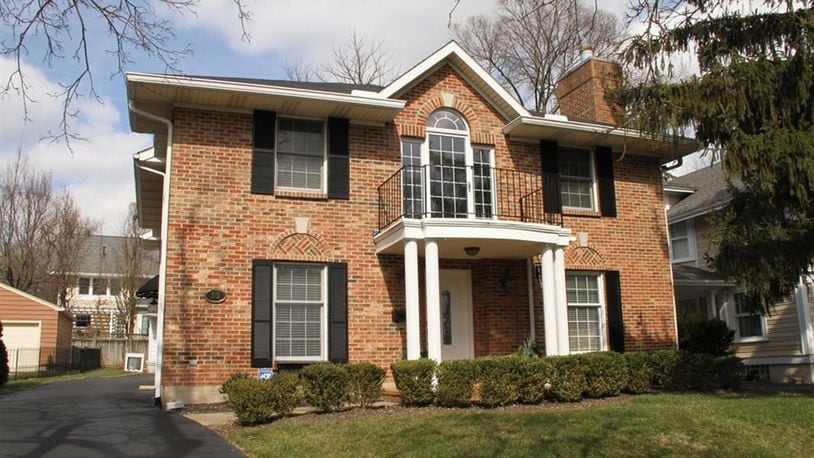 This brick 2-story offers about 3,170 sq. ft. of living space with 3 or 4 bedrooms. Grassy areas are to each side of the garage, and the yard is fenced except across the front and driveway. CONTRIBUTED PHOTOS BY KATHY TYLER
