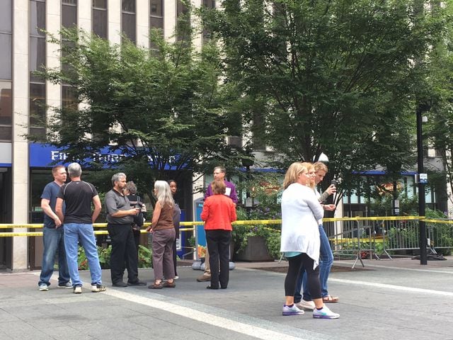 Photos: Locals honor three killed day after Fountain Square shooting