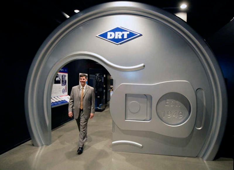 Brady Kress walks through a giant pop-top can which is part of the Dayton Reliable Tool display and a tribute to inventor Ermal Fraze. 