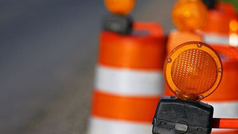 Orange barrels will be a familiar sight along Interstate 70 as construction crews make guardrail repairs under the Possum Road Bridge.  FILE PHOTO