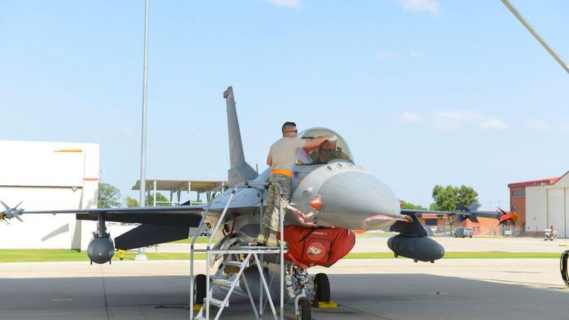 Staff Sgt. Brian Dement, a crew chief assigned to the 180th Fighter Wing, Ohio Air National Guard, polishes the canopy of an F-16 Fighting Falcon before early morning training sorties at Patrick Air Force Base, Fla., Jan. 30. (Air National Guard photo/Senior Airman Hope Geiger)