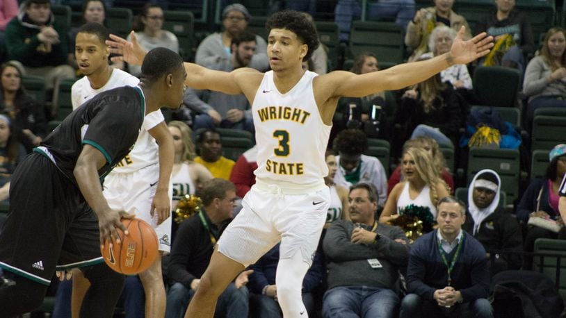 Wright State’s Mark Hughes defends against Green Bay last season. Allison Rodriguez/CONTRIBUTED