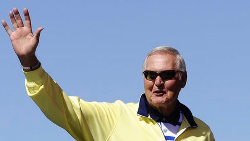 In this Sept. 20, 2015, file photo, former NBA player Jerry West greets fans during drivers introduction for the NASCAR Sprint Cup Series auto race at Chicagoland Speedway in Joliet, Ill. West could be leaving his job as an adviser to the NBA champion Golden State Warriors to take a similar role with the Los Angeles Clippers. West told ESPN he's intrigued at the prospect of working for team owner Steve Ballmer, whom he calls "a winner." (AP Photo/Matt Marton, File)