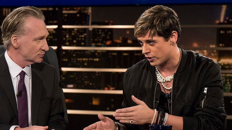 In this photo provided by HBO, host Bill Maher, left, listens to Milo Yiannopoulos, a writer for Breitbart News, on HBO's "Real Time with Bill Maher," Friday, Feb. 17, 2017, in Los Angeles. (Janet Van Ham/HBO via AP)