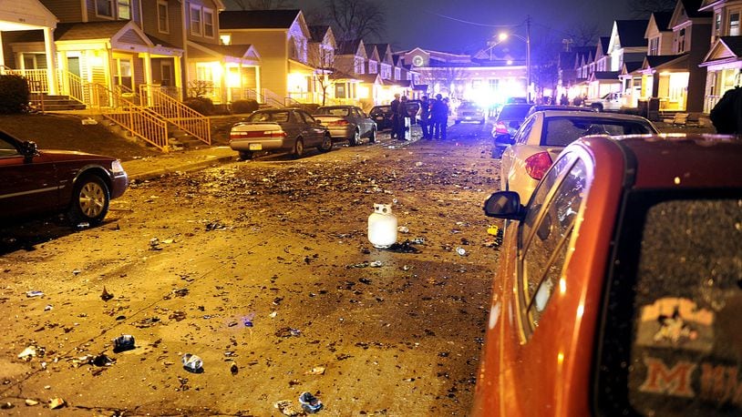Debris litters Kiefaber Street on the University of Dayton campus — in the heart of the neighborhood known for many years as the “UD ghetto” — after students rioted early Sunday morning, March 17.