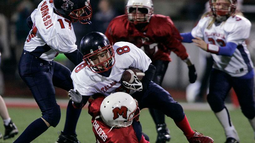Madison and Talawanda fourth, fifth and sixth grade peewee football teams play a scrimmage during halftime of the Miami University game against Ball State Tuesday, Nov. 11, 2008 in Oxford, Ohio. Staff photo by Nick Graham