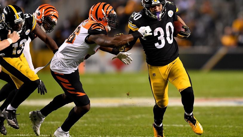 PITTSBURGH, PA - DECEMBER 30: James Conner #30 of the Pittsburgh Steelers carries the ball against the Cincinnati Bengals in the third quarter during the game at Heinz Field on December 30, 2018 in Pittsburgh, Pennsylvania. (Photo by Joe Sargent/Getty Images)