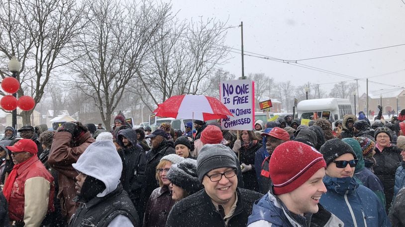 Despite a few inches of snow, people gathered for an annual march on Monday to celebrate the life of civil rights leader Martin Luther King Jr. Marchers walked throughout town and to the Dayton Convention Center in downtown Dayton where a rally was held.