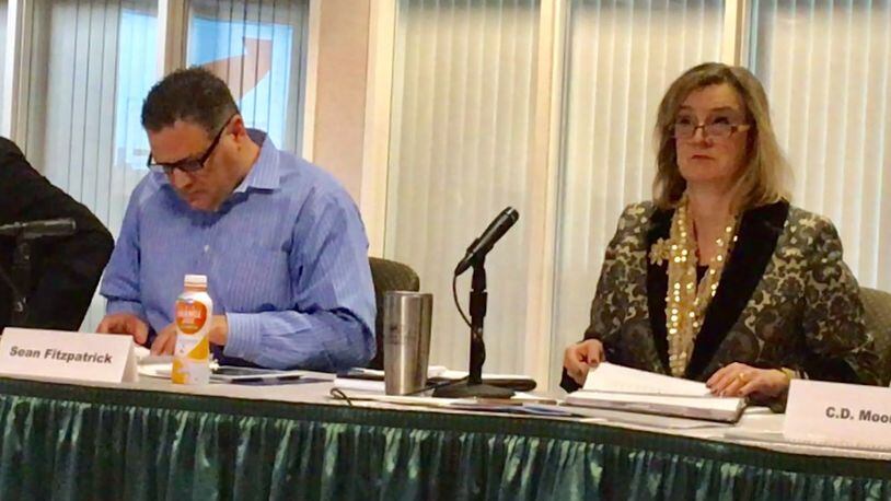 Chairman of Wright State’s finance committee Sean Fitzpatrick and university president Cheryl Schrader sit at a board of trustees meeting on Friday.