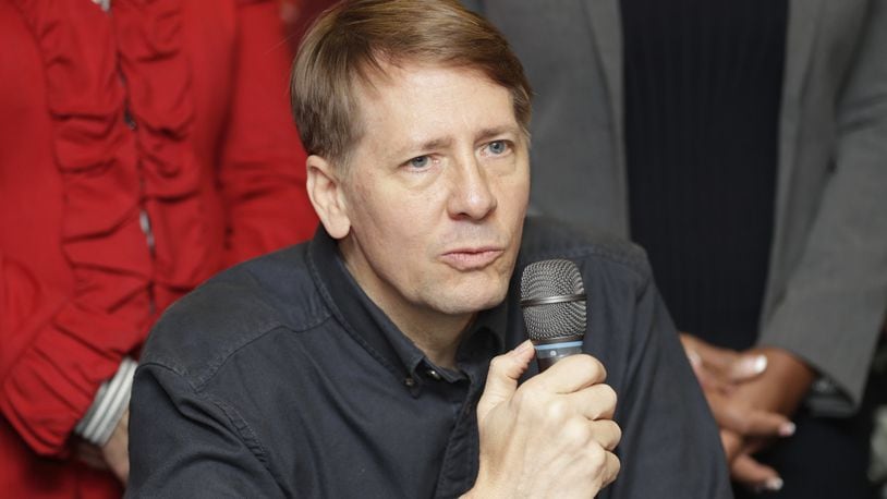 Richard Cordray speaks during a news conference, Wednesday, Jan. 10, 2018, in Akron, Ohio. (AP Photo/Tony Dejak)