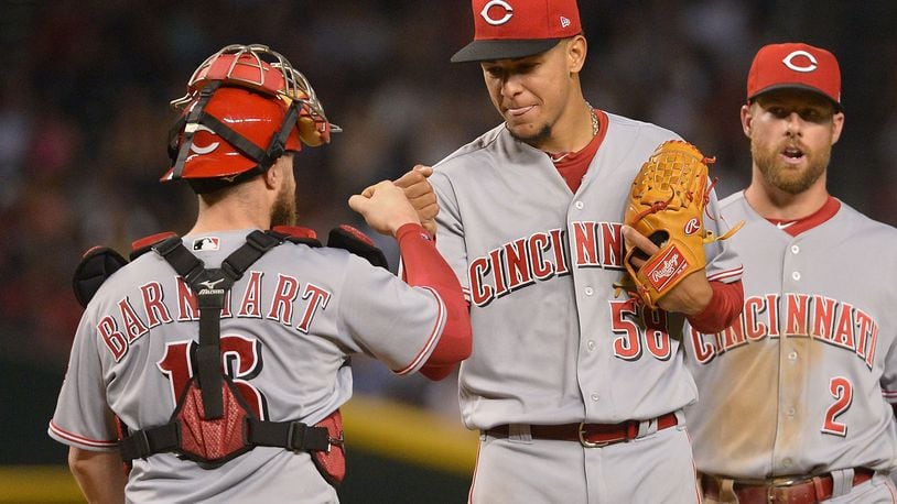 PHOENIX, AZ - JULY 08: Luis Castillo #58 of the Cincinnati Reds is congratulated by Tucker Barnhart #16 after being relieved during the seventh inning of the MLB game against the Arizona Diamondbacks at Chase Field on July 8, 2017 in Phoenix, Arizona. (Photo by Jennifer Stewart/Getty Images)