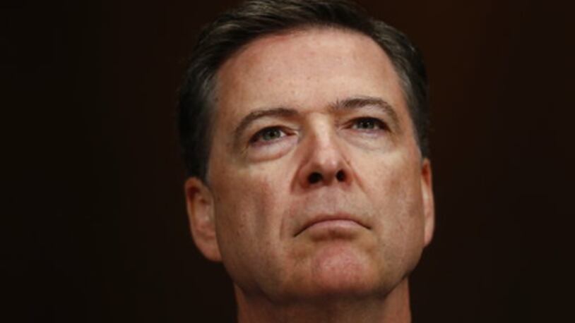 FILE- In this May 3, 2017, file photo, FBI Director James Comey listens on Capitol Hill in Washington. Comey's memo relating President Donald Trumpâs request to shut down an investigation of his ousted national security adviser is a powerful piece of evidence that could be used to build an obstruction of justice case against the president. But criminal charges of interfering with an investigation are difficult in ordinary circumstances, several former federal prosecutors cautioned Wednesday, May 17, 2017, a day after word of the existence of the memo broke. (AP Photo/Carolyn Kaster, File)