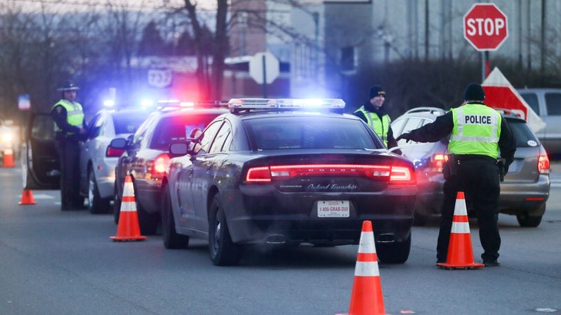 Police at an OVI checkpoint in Oxford. GREG LYNCH / STAFF