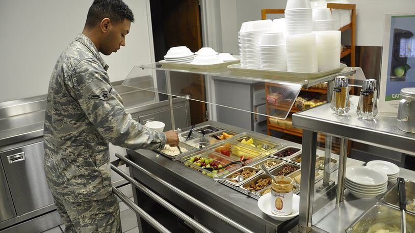 Airman Chris Savinon, Phase 2 tech school student, explores the healthier choices on the new breakfast bar at the Pitsenbarger Dining Facility. The breakfast bar is part of the Go for Green 2.0 upgrade. (U.S. Air Force photo/Mark C. Lyle)