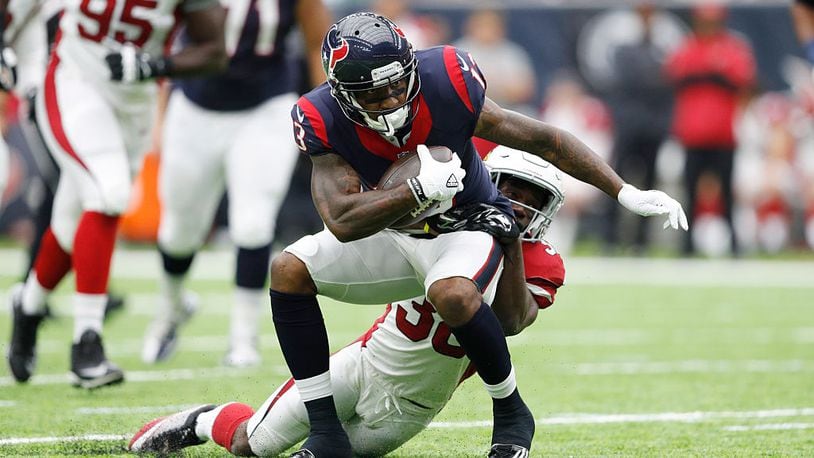 HOUSTON, TX - AUGUST 28: Braxton Miller #13 of the Houston Texans is tackled by Ronald Zamort #38 of the Arizona Cardinals after a reception in the second quarter of a preseason NFL game at NRG Stadium on August 28, 2016 in Houston, Texas. (Photo by Joe Robbins/Getty Images)