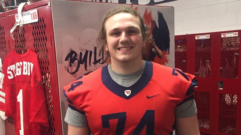 Alter offensive lineman Nathan Grey poses for a photo in the Dayton football locker room. Submitted photo