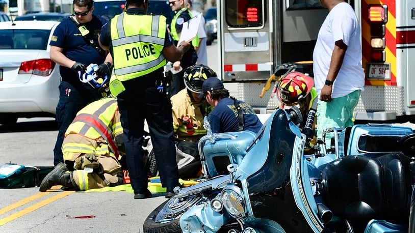 A motorcyclist who reportedly was not wearing a helmet was injured in a crash involving a car on North Fairfield Road in Beavercreek Monday, April 15, 2024. MARSHALL GORBY\STAFF