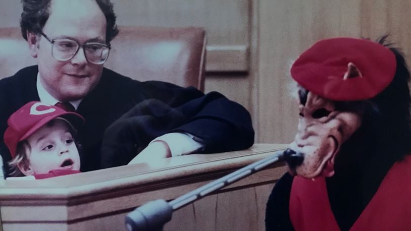 At the very first Big Bad Wolf Trial in 1989, Judge Dan Gehres and his three-year-old son Frank -- who had crawled up on his dad’s lap during the most gripping testimony – listen to the Big Bad Wolf (played by Gehres’ bailiff Chuck Taylor in a red cap and vest) give his account of the events. Today ,Frank Gehres will be sworn in as a Dayton Municipal Court Judge by his father, whose seat he is taking, Judge Dan Gehres retire Dec. 31. Chuck Taylor, who has been the bailiff and great friend of Dan Gehres for 36 years will now be the bailiff for Frank Gehres. CONTRIBUTED