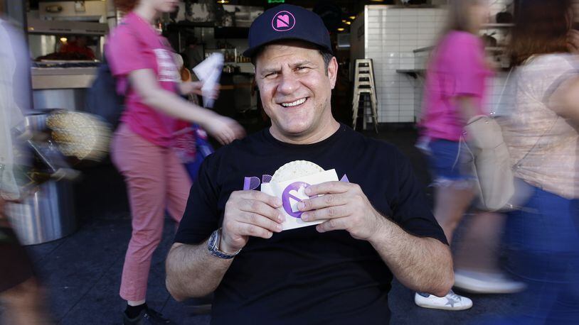 Umami Burger founder Adam Fleischman, with a peanut butter and jelly sandwich, at Grand Central Market in Los Angeles, Calif. (Christian K. Lee/Los Angeles Times/TNS)
