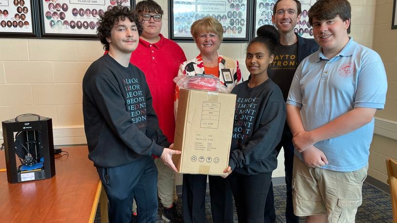 Dayton Public School students with Greg Loughnane, a University of Dayton professor in the Department of
Mechanical and Aerospace Engineering, who is leading the Digital
Manufacturing Workshop.