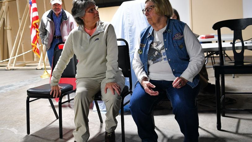 Terry Calvert (left) and Carmen "Penny" Adams talk before a program at the Miami Valley Veterans Museum. The women are among area residents included in a new exhibit on women in the military that opened March 18. Contributed