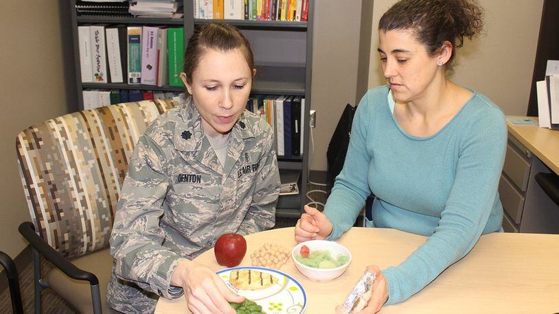 Lt. Col. Amanda Denton, Nutritional Medicine Flight commander and Air Force Materiel Command nutrition consultant, and Kendra Schmuck, nutrition clinic manager, can help patients achieve their personal nutrition goals for a healthier lifestyle. The 88th Medical Group nutrition clinic provides medical nutritional therapy for active-duty members, retirees and their dependents offering classes and individual appointments to provide nutritional guidance. (U.S. Air Force photo/Stacey Geiger)