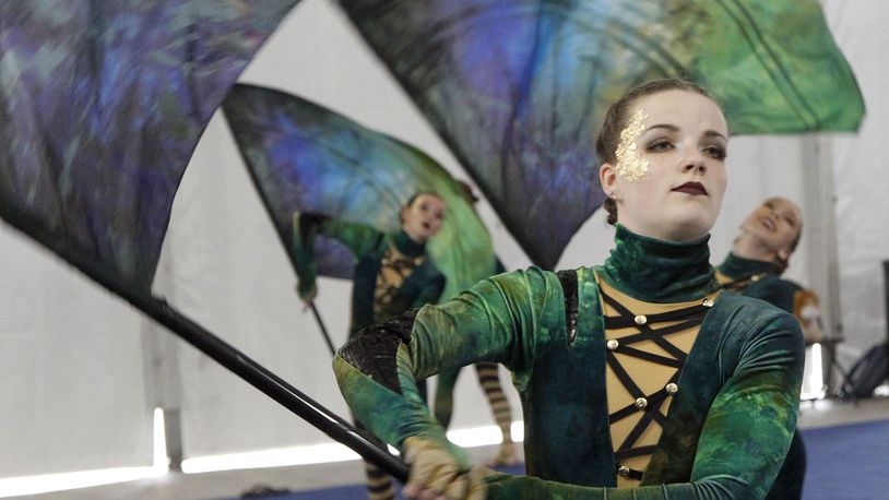Miamisburg High School World Guard member Crystal Rooks, 18, warms up for Winter Guard International competition at UD Arena on Thursday morning. TY GREENLEES / STAFF