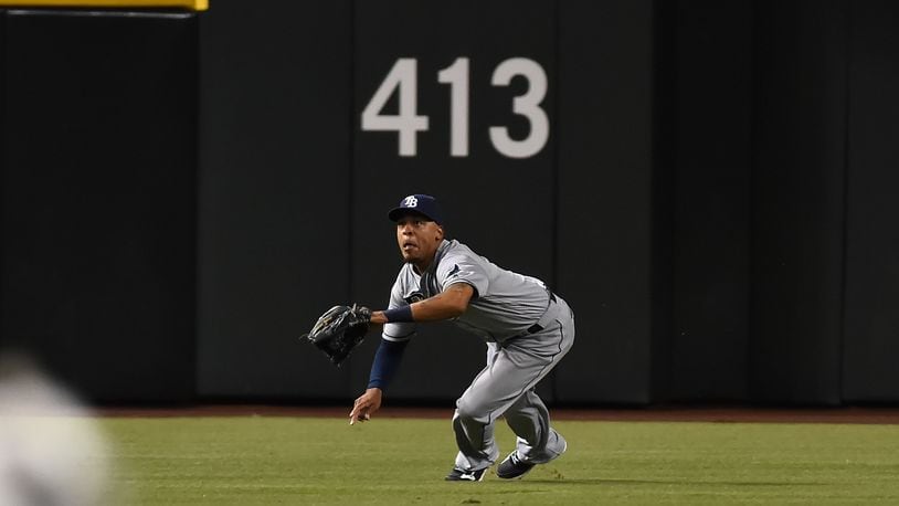 PHOENIX, AZ - JUNE 07: Desmond Jennings #8 of the Tampa Bay Rays makes a diving catch against the Arizona Diamondbacks during the second inning at Chase Field on June 7, 2016 in Phoenix, Arizona. (Photo by Norm Hall/Getty Images)