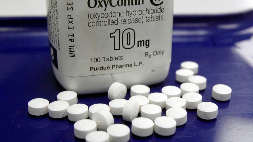 FILE - This Feb. 19, 2013, file photo shows OxyContin pills arranged for a photo at a pharmacy in Montpelier, Vt. Nevada has struck a $45 million settlement deal with McKinsey & Company for the global consulting firm's role in advising opioid makers how to sell more prescription painkillers amid a national overdose crisis. The western state reached the deal after sitting out a multi-state settlement with McKinsey announced in February. The hard bargaining has allowed Nevada to win a settlement that's three and a half times larger than the average settlement with other states. (AP Photo/Toby Talbot, File)
