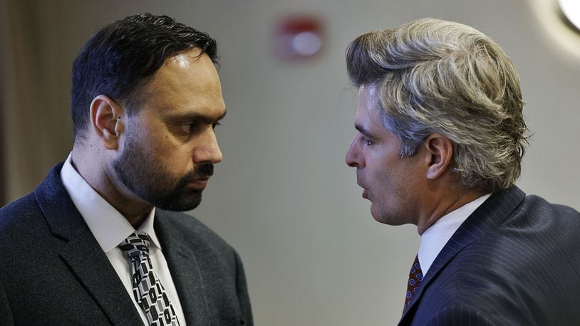Defense attorney Charles M. Rittgers, right, speaks with his client Gurpreet Singh, charged in a quadruple homicide in West Chester Twp., during a hearing in Butler County Common Pleas Court Wednesday, Nov. 10, 2021 in Hamilton. NICK GRAHAM / FILE PHOTO