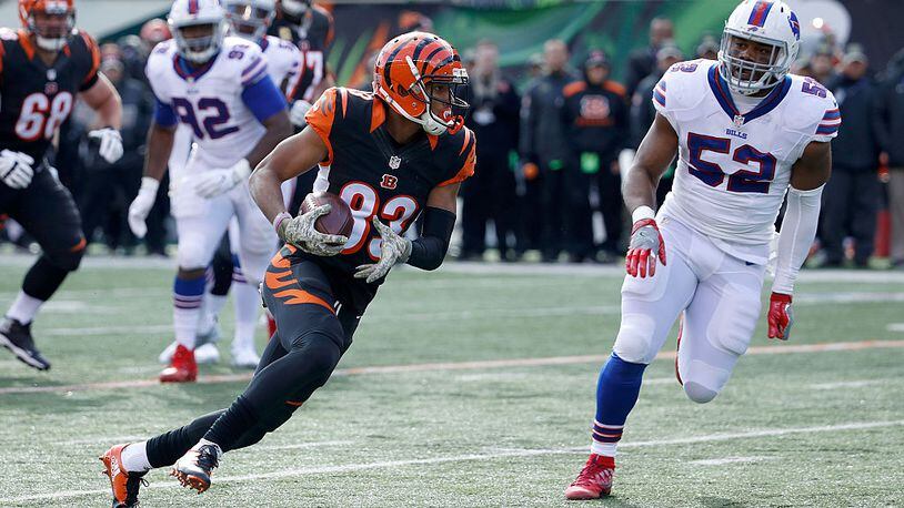 CINCINNATI, OH - NOVEMBER 20: Tyler Boyd #83 of the Cincinnati Bengals runs the ball past Preston Brown #52 of the Buffalo Bills during the first quarter at Paul Brown Stadium on November 20, 2016 in Cincinnati, Ohio. (Photo by Joe Robbins/Getty Images)