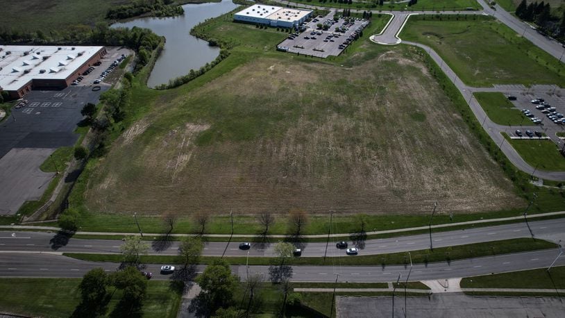 The Dayton Regional STEM School plans to buy more than 9 acres from the city of Kettering in Miami Valley Research Park to build a new elementary school. The existing STEM school building is at the left edge of the photo, with Woodman Drive at the bottom. Jim Noelker/ Staff