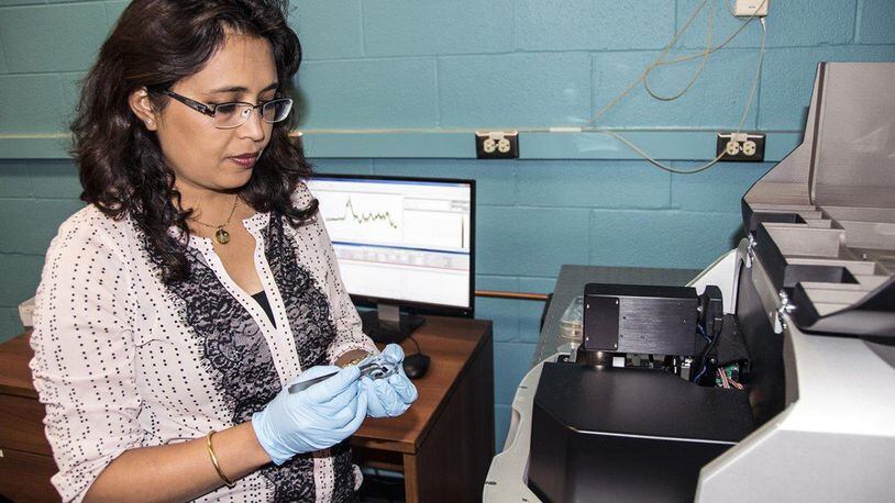 Air Force Research Laboratory research materials engineer Dr. Dhriti Nepal of the AFRL Composites Performance team performs nano-IR characterization of a nanocomposite material in the microscopy laboratory. (U.S. Air Force photo/David Dixon)