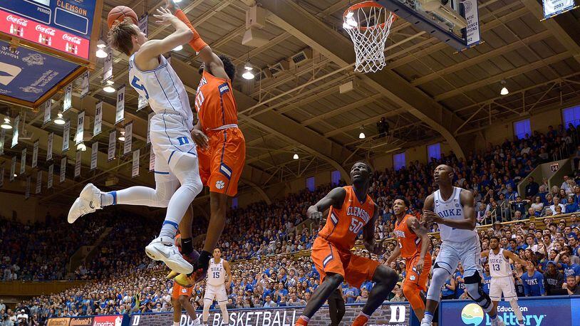 DURHAM, NC - FEBRUARY 11: Luke Kennard #5 of the Duke Blue Devils shoots against Gabe DeVoe #10 of the Clemson Tigers during the game at Cameron Indoor Stadium on February 11, 2017 in Durham, North Carolina. (Photo by Grant Halverson/Getty Images)