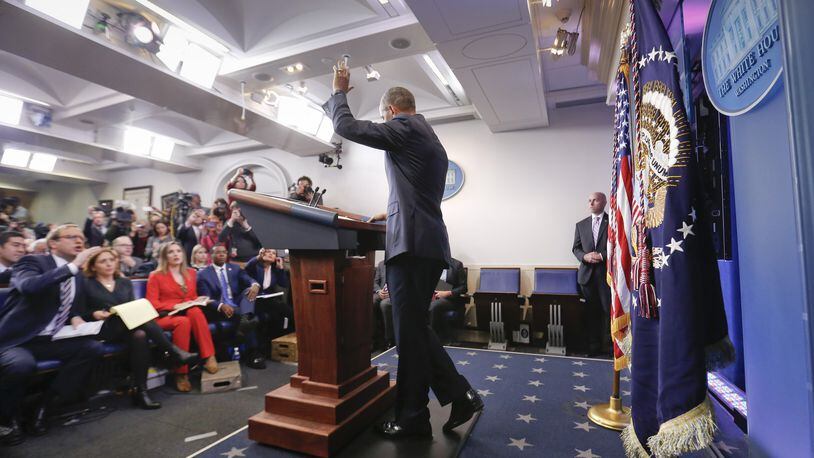 President Barack Obama waves at the conclusion of his final presidential news conference onWednesday in the briefing room of the White House.