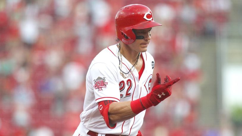 The Reds' Derek Dietrich rounds the bases after a home run in the fourth inning against the Pirates on Tuesday, May 28, 2019, at Great American Ball Park in Cincinnati.