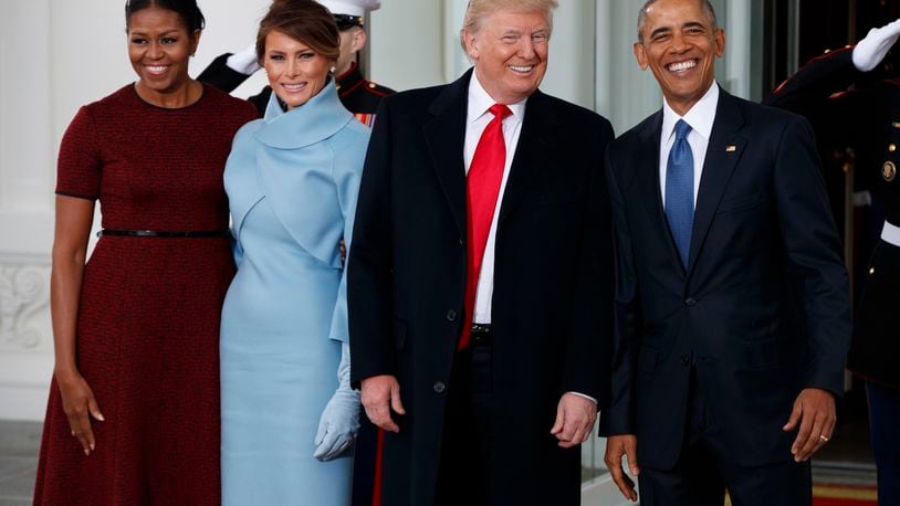 President Barack Obama, first lady Michelle Obama, President-elect Donald Trump and Melania Trump stand at the White House in Washington, Friday, Jan. 20, 2017. (AP Photo/Evan Vucci)